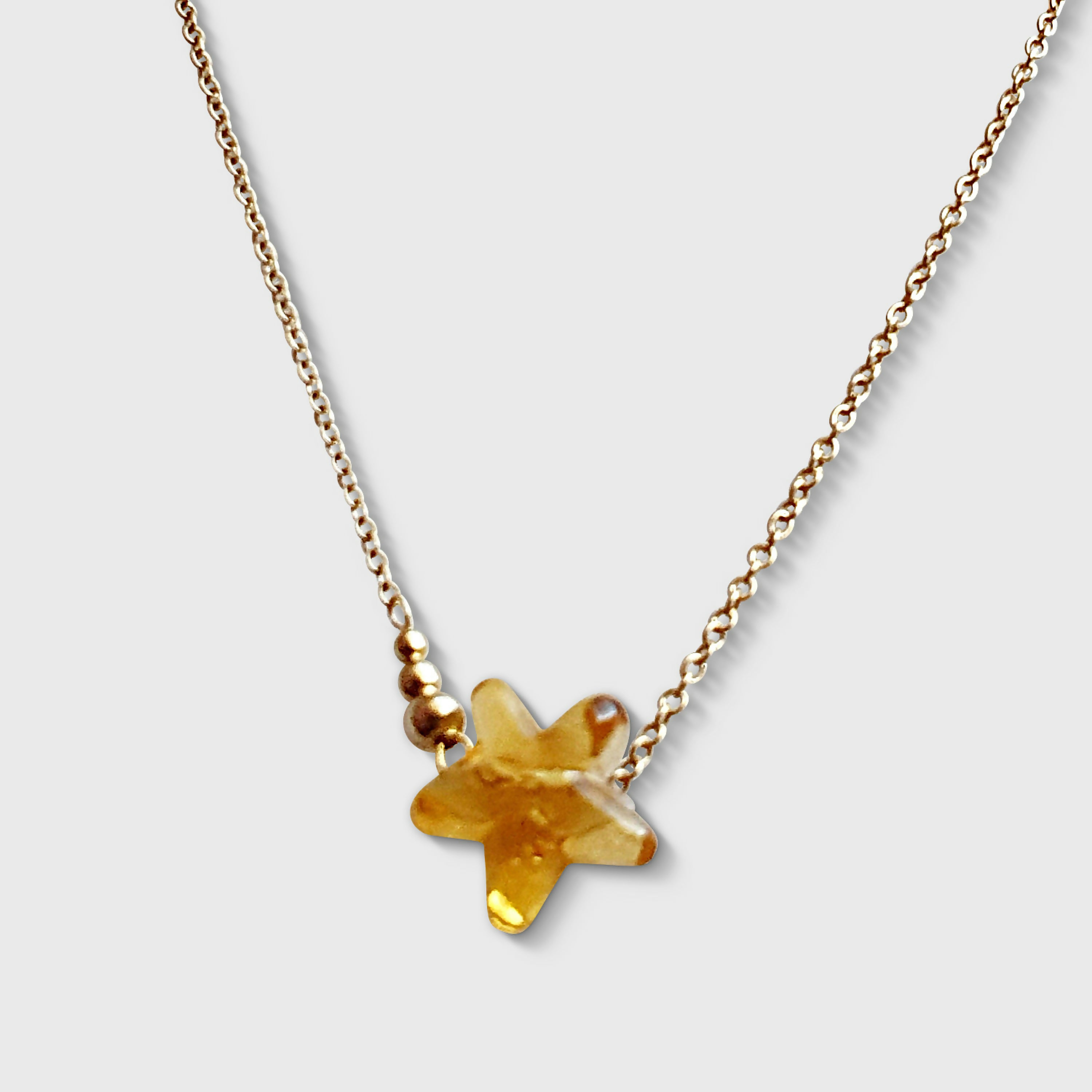 Collier petite étoile filante en verre de Murano doré | EMPREINTES Paris