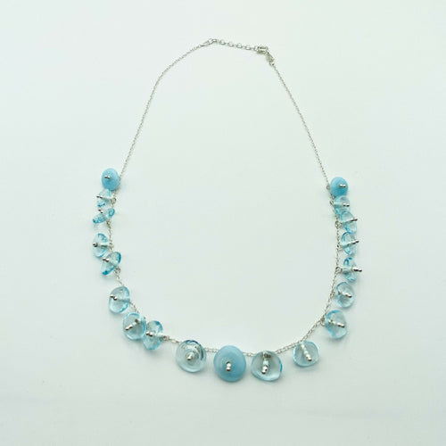 collier_avec_perles_en_verre_bleu_transparent_tres_clair_monte_sur_une_chaine_en_argent_lathoumetie_helene copie | EMPREINTES Paris - EMPREINTES Paris