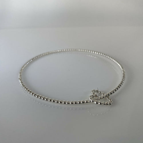 bracelet_jonc_en_argent_massif_et_sa_breloque_coeur_en_fil_perle_artyssia | EMPREINTES Paris - EMPREINTES Paris