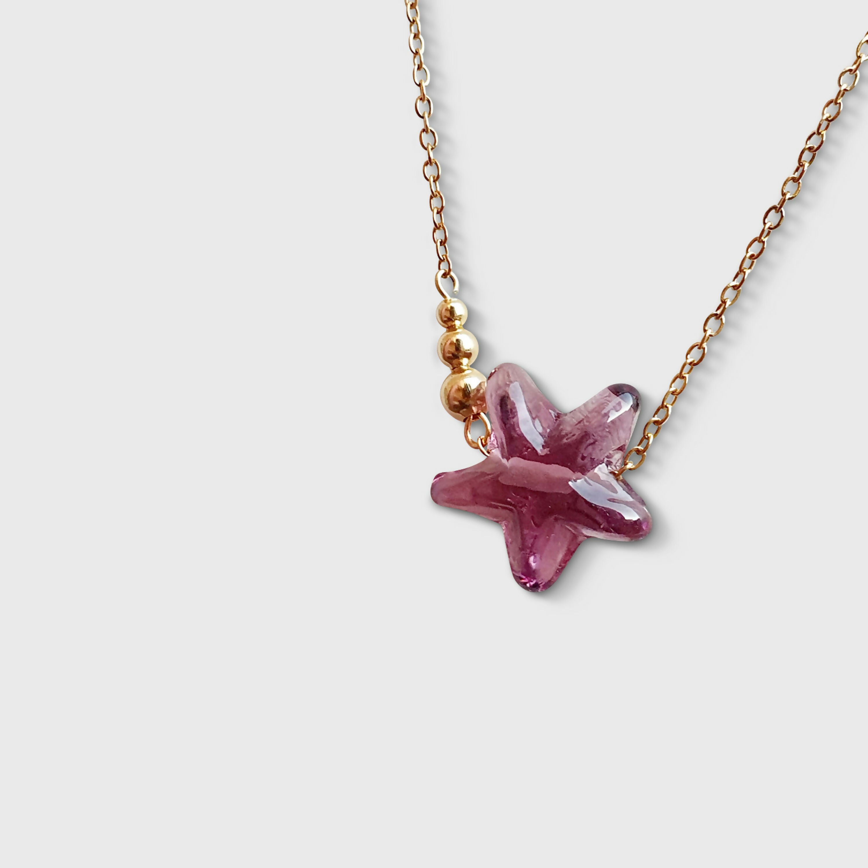 Collier petite étoile filante en verre de Murano rose et doré | EMPREINTES Paris