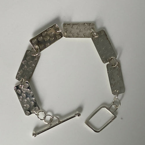 Bracelet en argent massif martelé, motif spirales | EMPREINTES Paris - EMPREINTES Paris