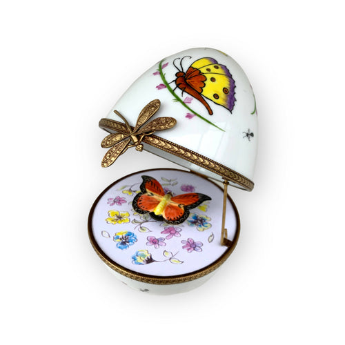 Oeuf musical blanc decor papillon orange | EMPREINTES Paris - EMPREINTES Paris