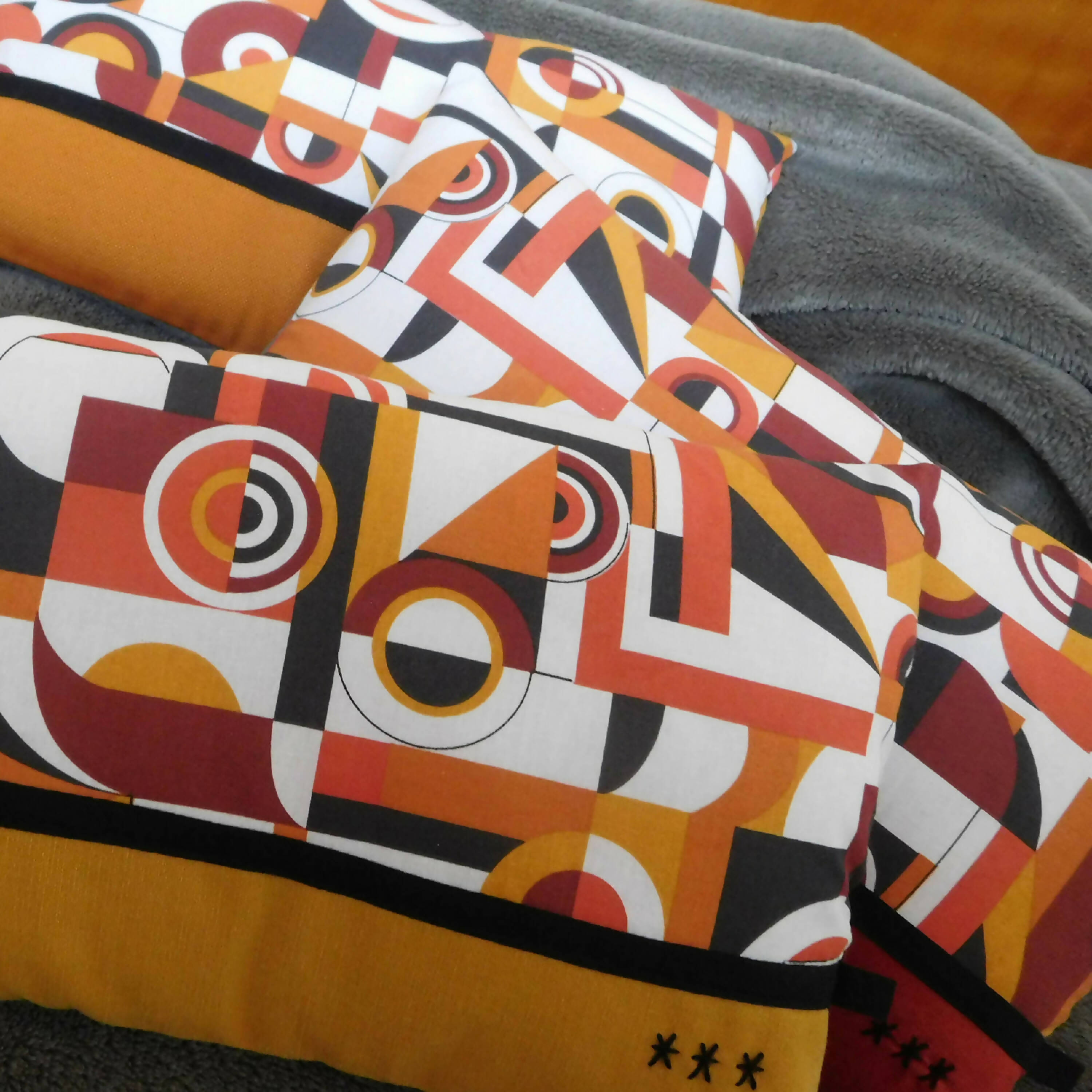 Coussin Géométric petit modèle bicolore orange | EMPREINTES Paris